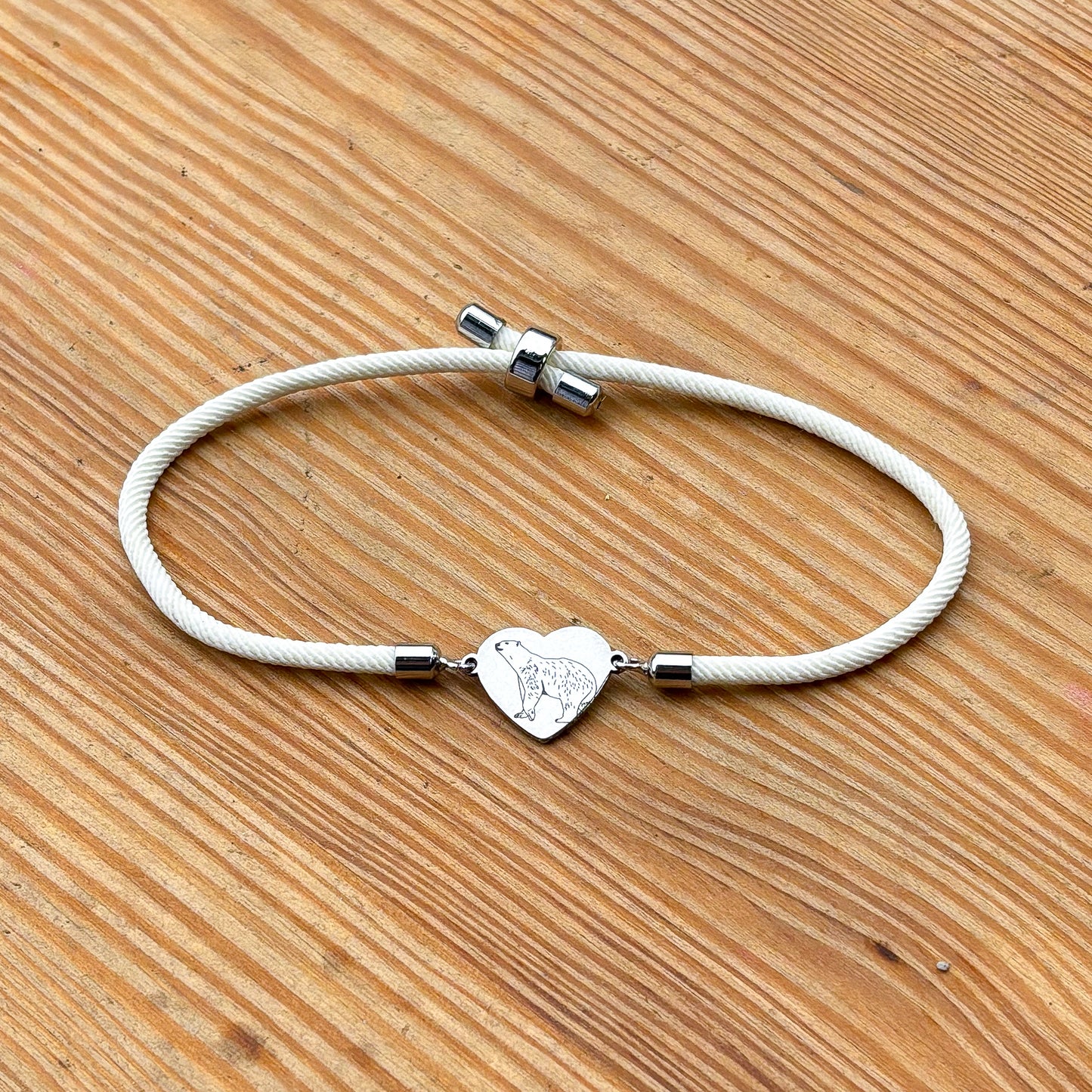 Polar bear 14x12mm heart silver on thick cord creamy white