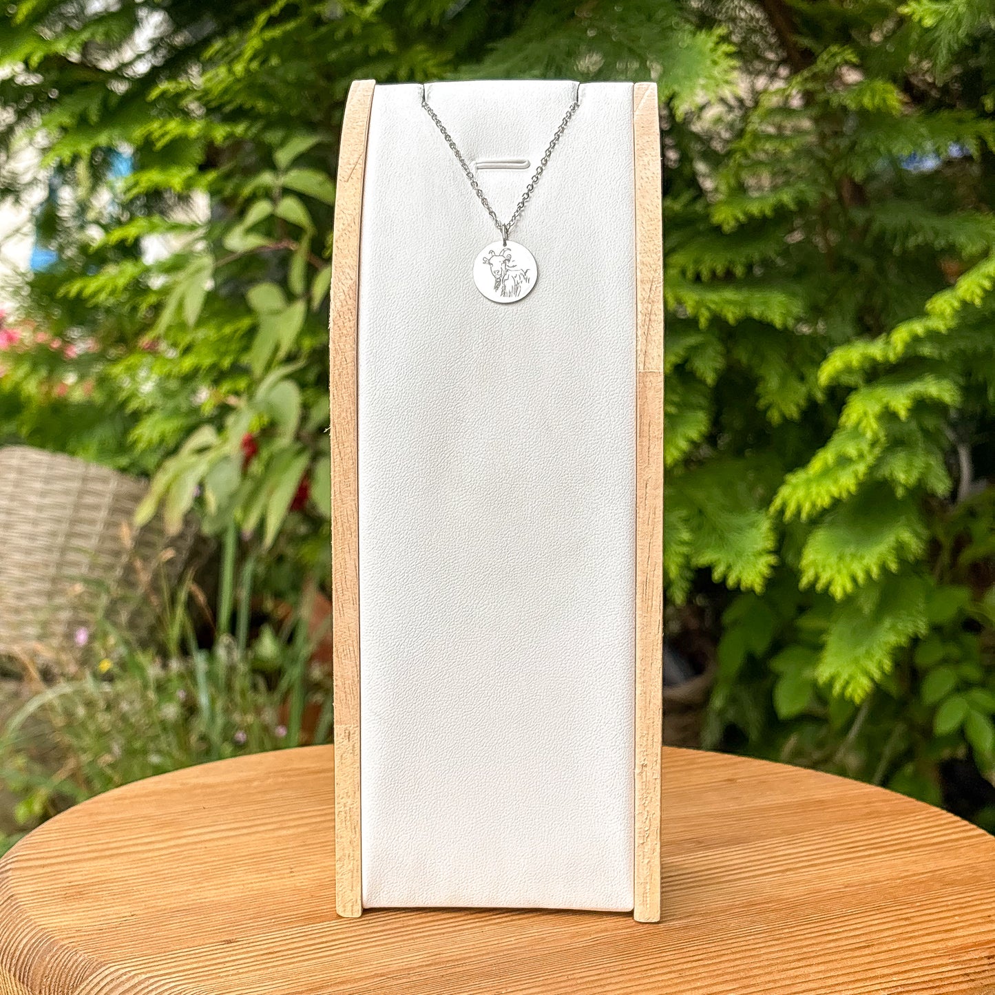 Goat head on a mountain necklace - stainless steel