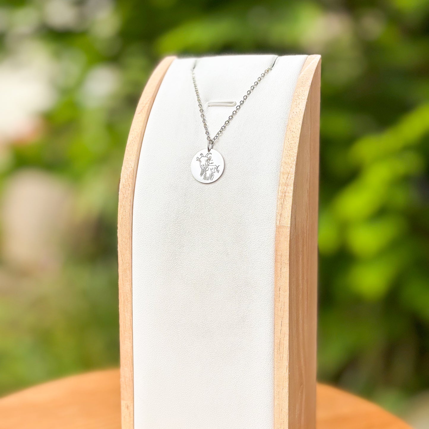 Goat head on a mountain necklace - stainless steel