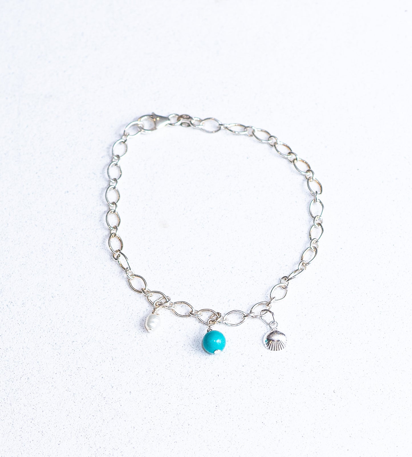 Turquoise, Fresh water pearl and shell charm bracelet
