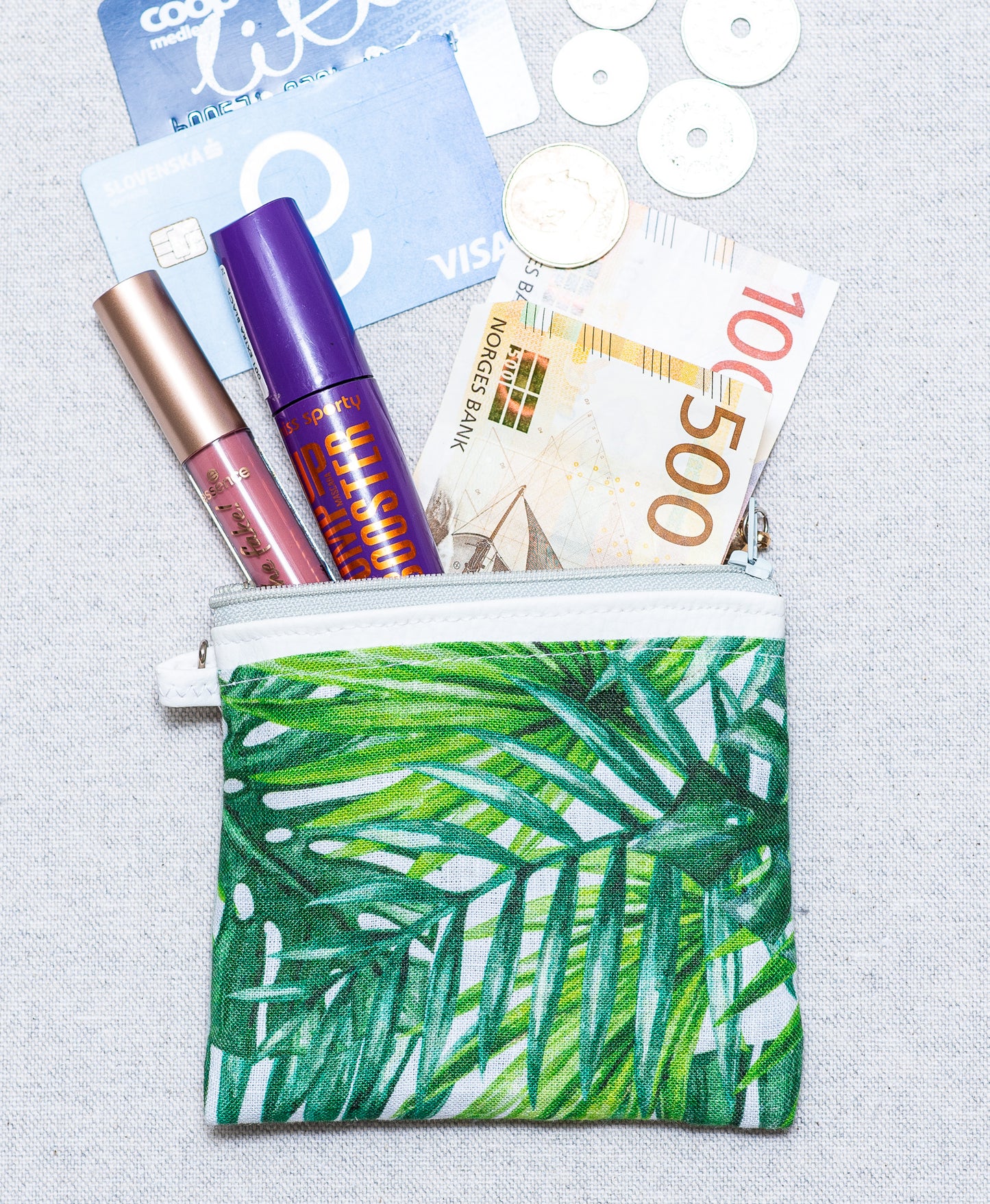 Coin bag palm leafs on linen