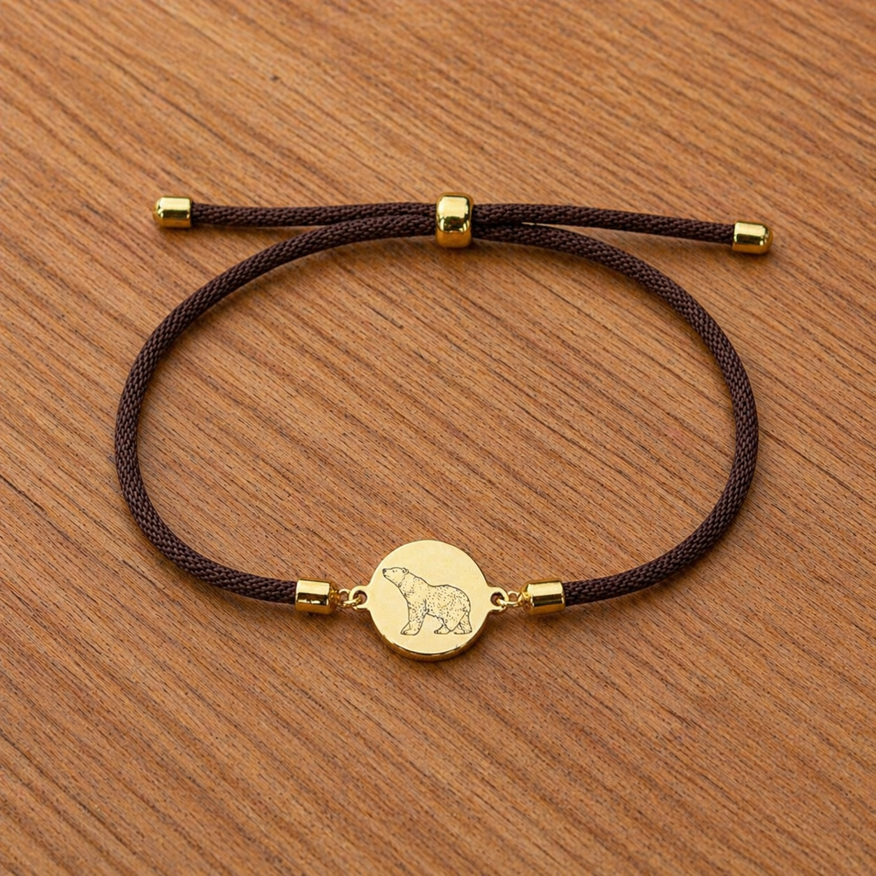 Polar bear 21mm round golden on textile cord brown