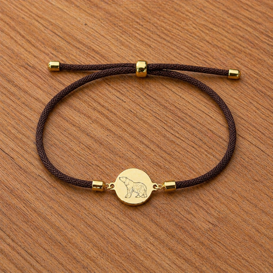 Polar bear 21mm round golden on textile cord brown