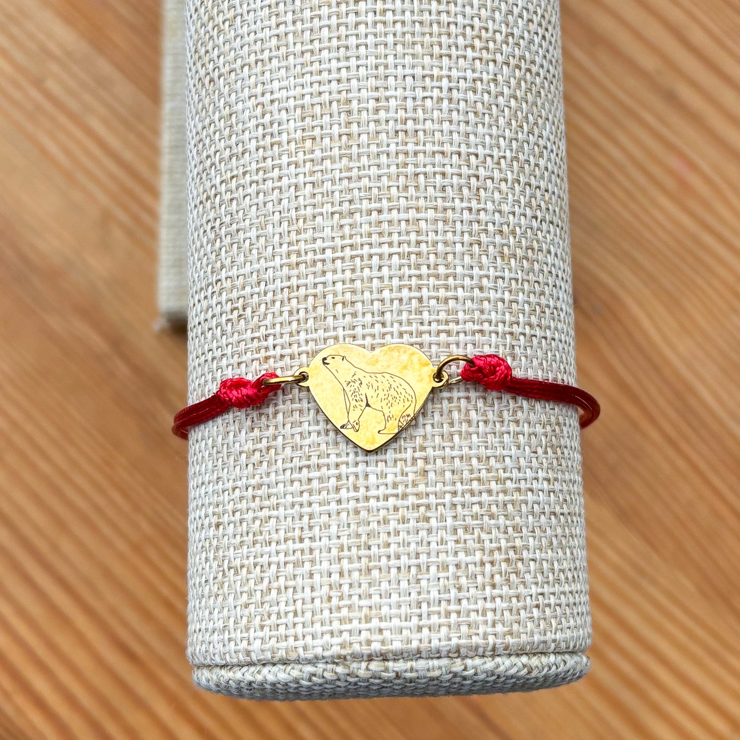 Polar bear 14x12mm heart golden on thin cord red