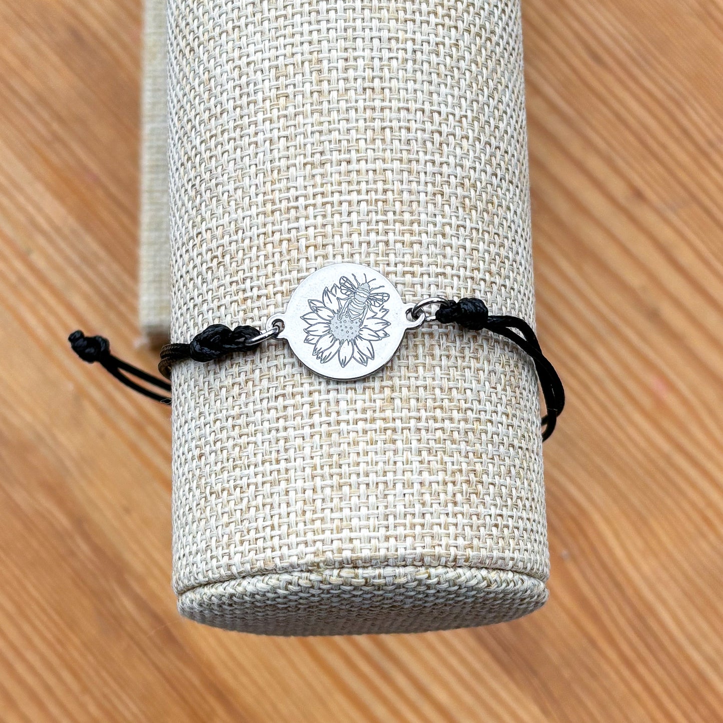 Bumble bee on sunflower on 21mm round silver on thin cord black