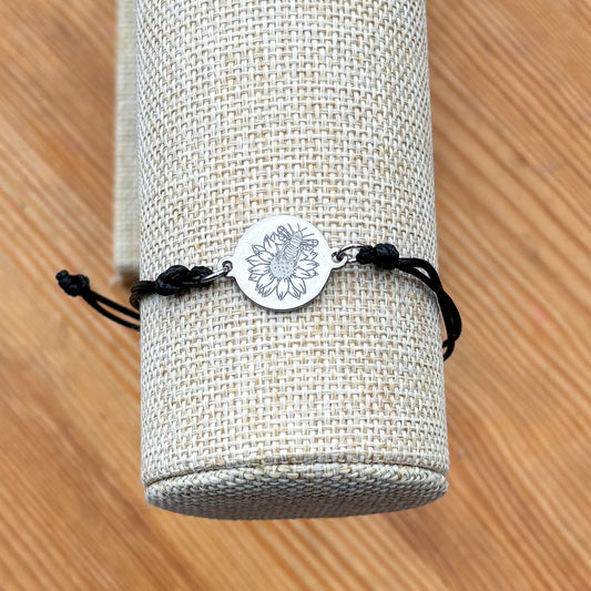 Bumble bee on sunflower on 21mm round silver on thin cord black