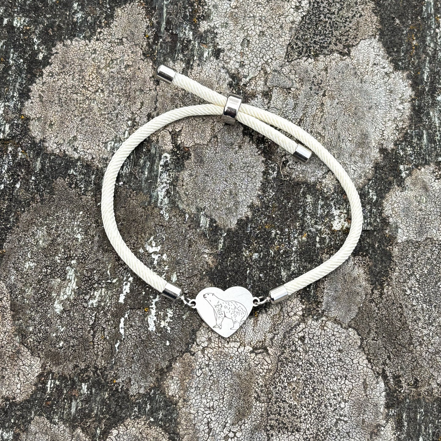 Polar bear 14x12mm heart silver on thick cord creamy white