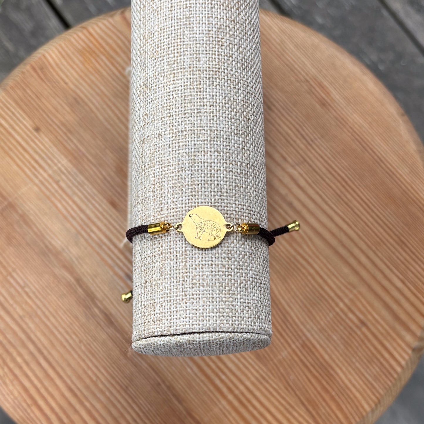 Polar bear 21mm round golden on textile cord brown