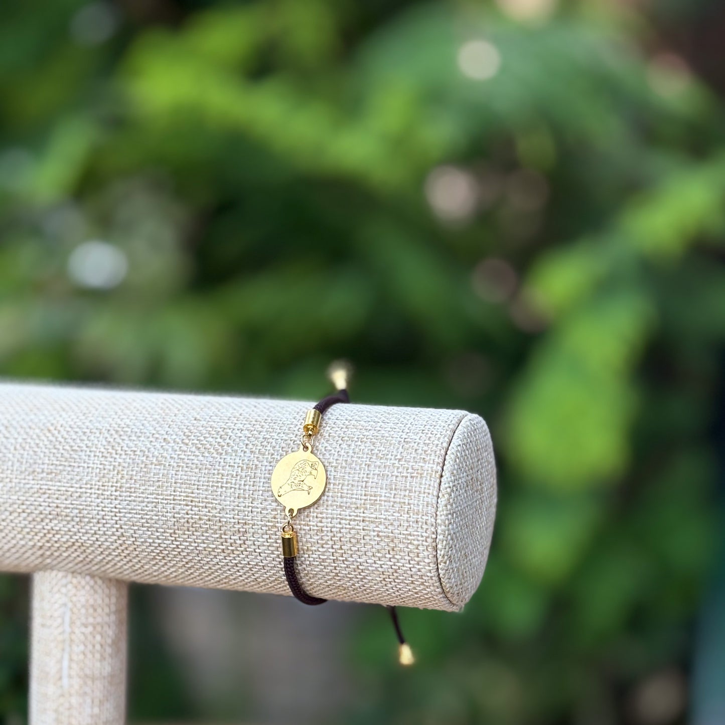 Polar bear 21mm round golden on textile cord brown