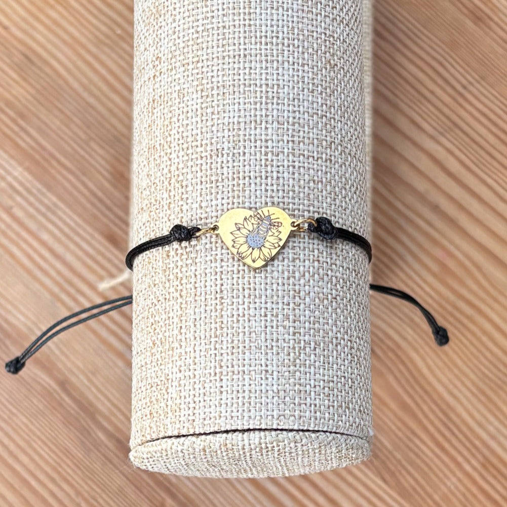 Bumble bee on sunflower on heart 14x12mm golden on thin cord  black