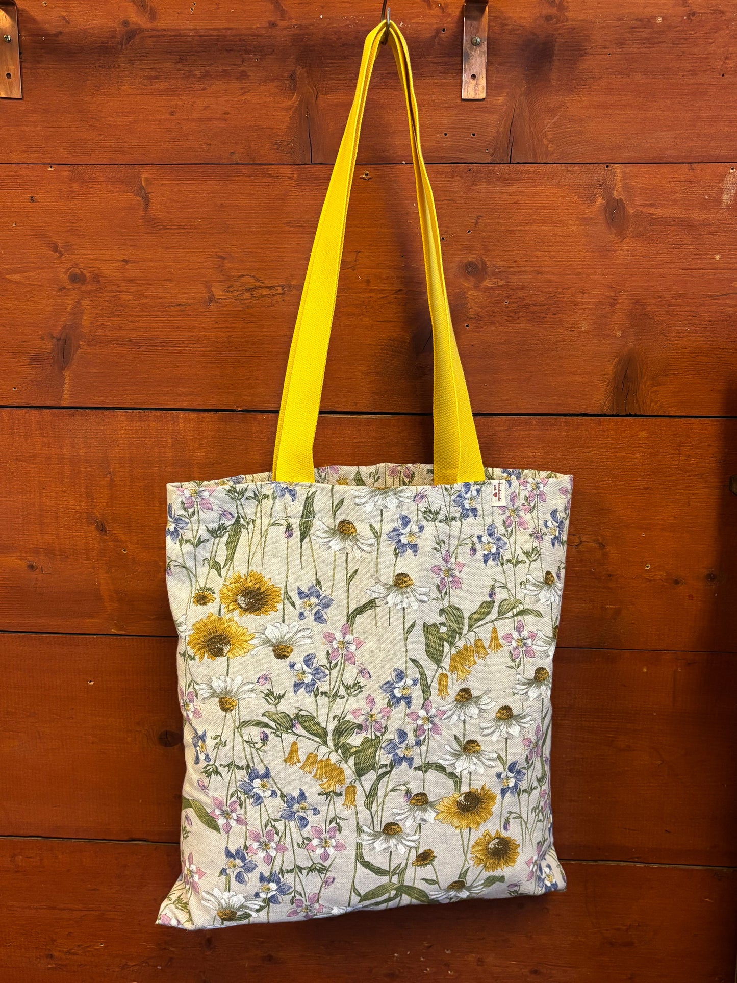 Floral field with sunflowers tote hand bag